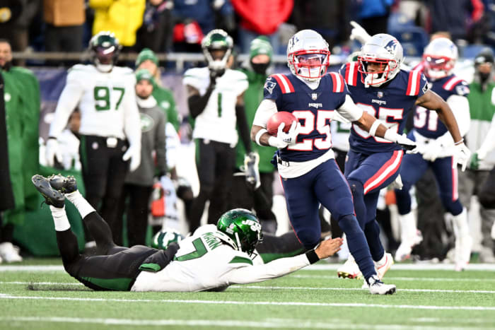 Jets' punter Braden Mann attempts to stop New England's Marcus Jones on the game-winning return
